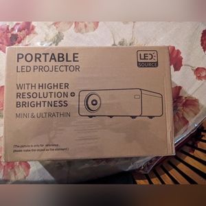 Mini movie projector New with lightning to HDMI cable